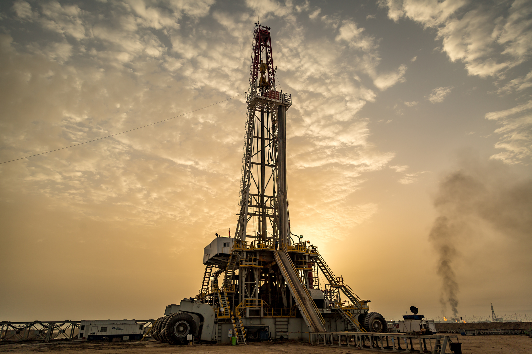 Oil drilling rig at dawn