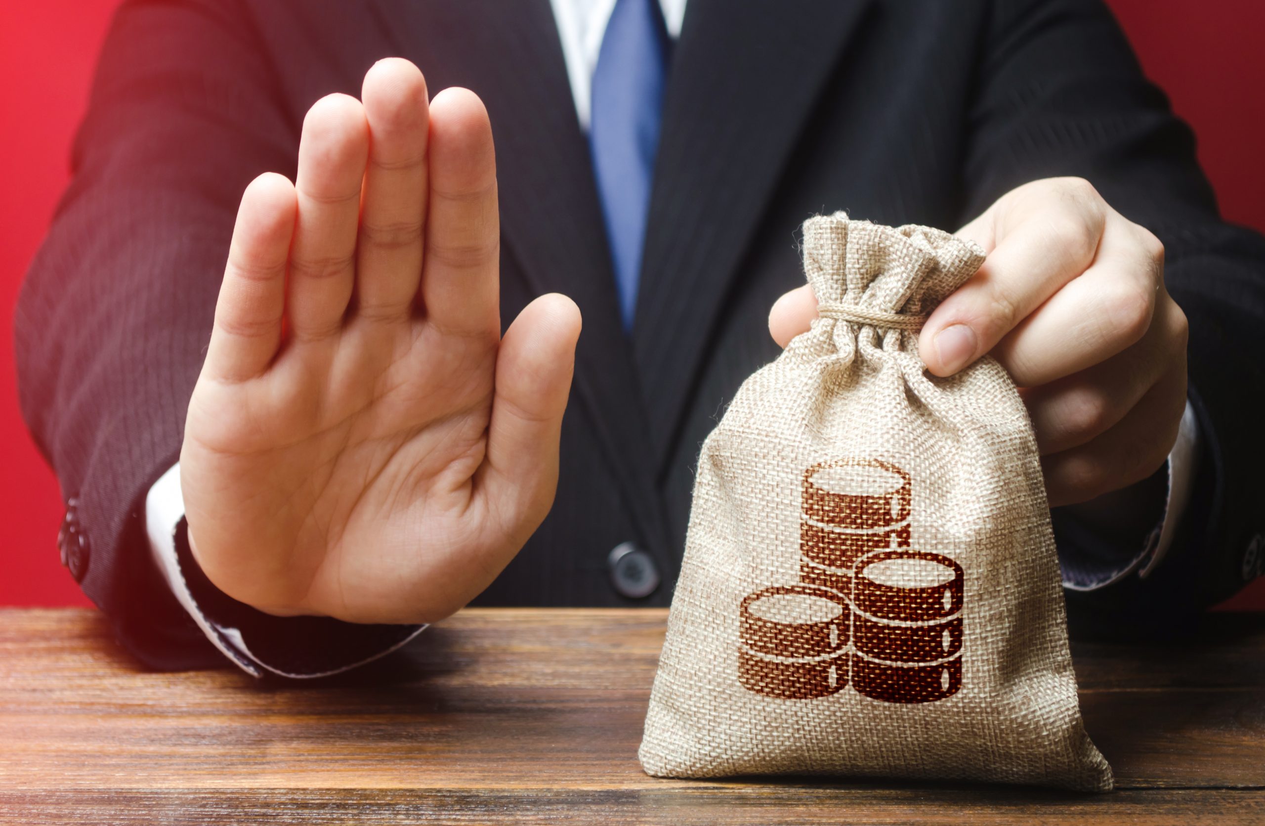 Businessman,Refuses,To,Give,Money,Bag.,Refusal,To,Grant,Loan